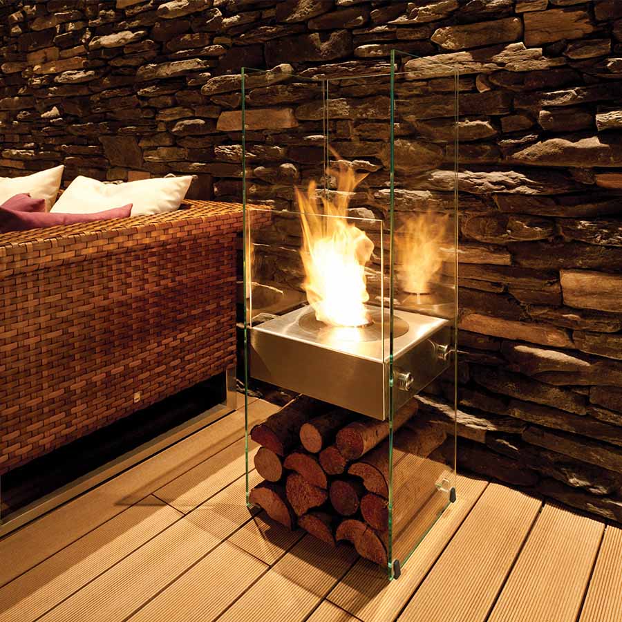 EcoSmart Fire Ghost Set Outdoors on dekcking with Log pile