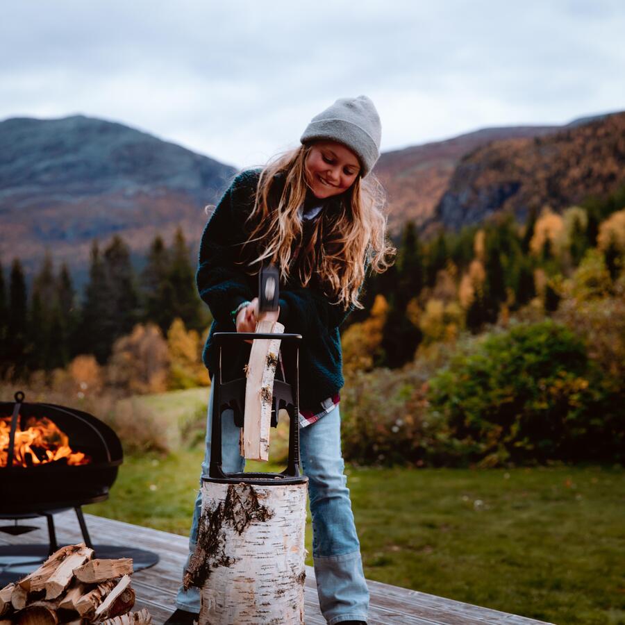 Chopping firewood for the fire pit using the Kindling Cracker