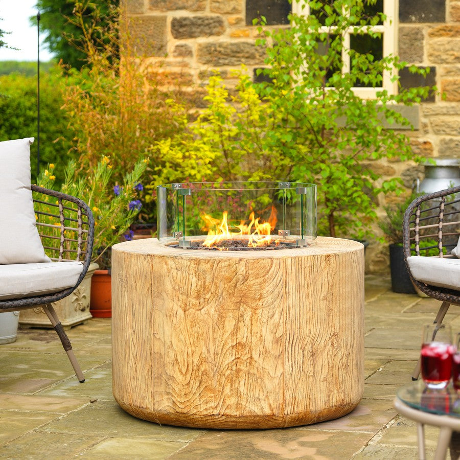 Verano Round Gas Firepit Table By Charlton And Jenrick Set on Cottage Patio